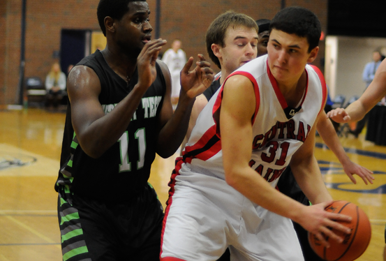 CMCC's Colton Bivighouse grabs a rebound while VTC's Rashad Powery-Saunds defends. Photo by Kim Lloyd.
