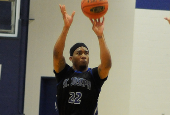 Dee Anderson drops in three of his 17 points against SMCC. Photo by Kim Lloyd.